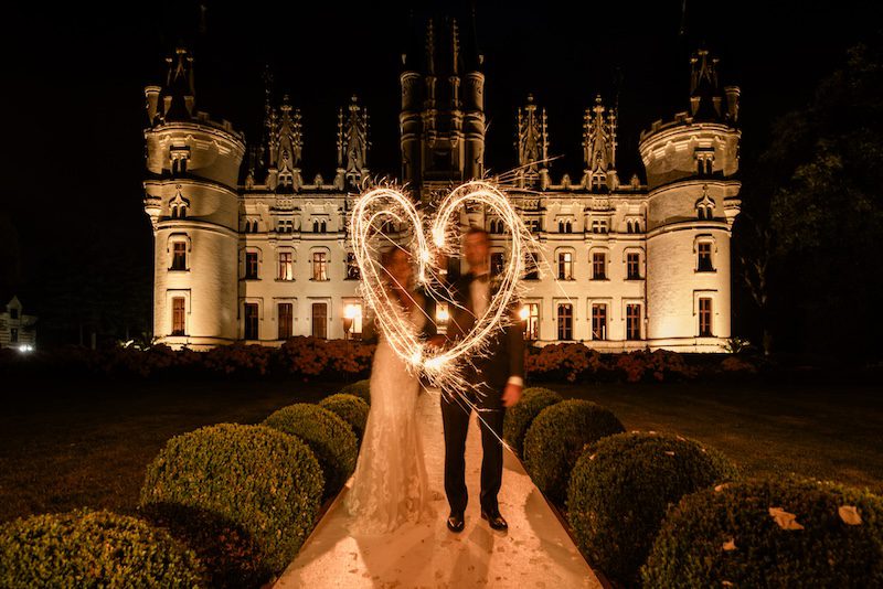 A romantic couple at a fairytale french chateau wedding